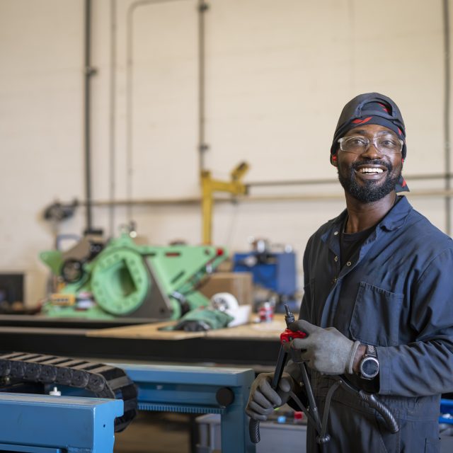 Man working in machine shop.