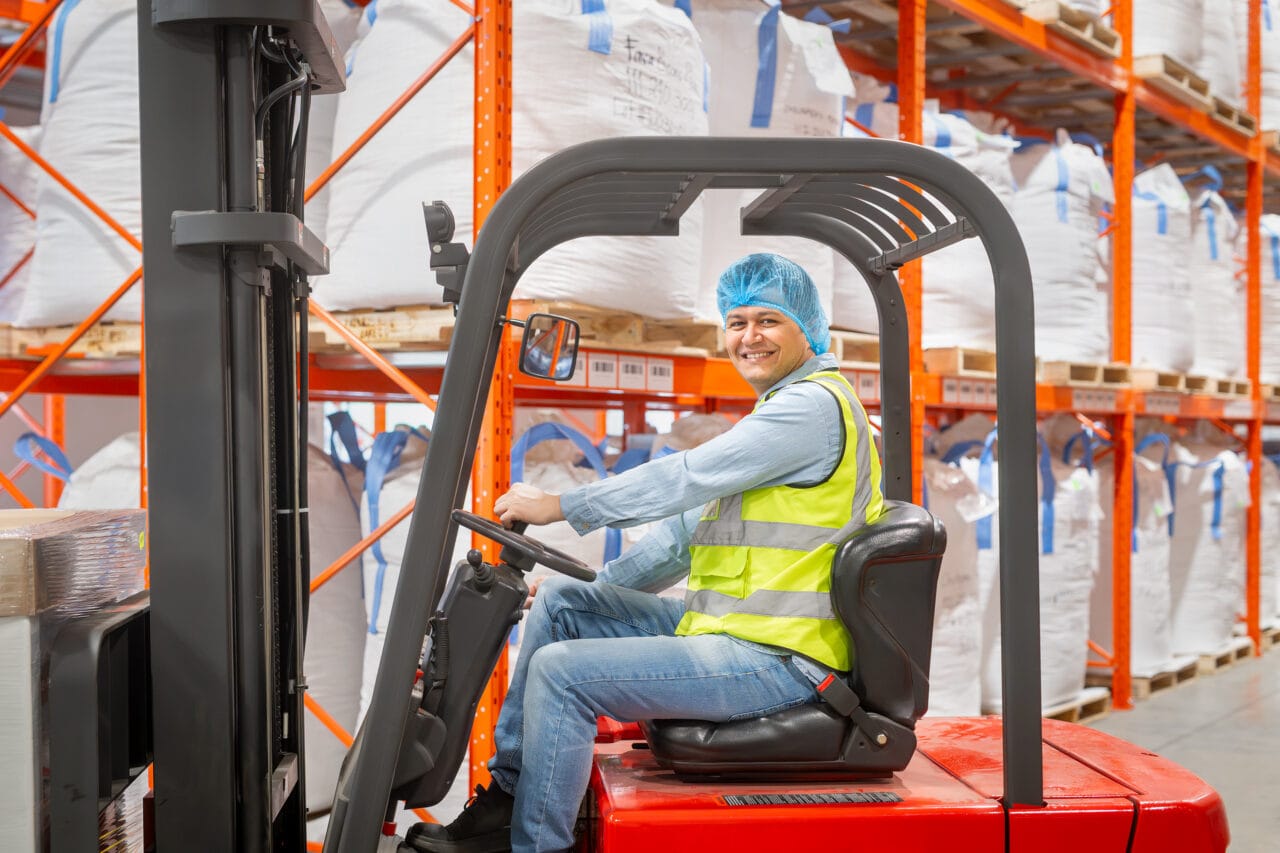 A man operating a forklift.