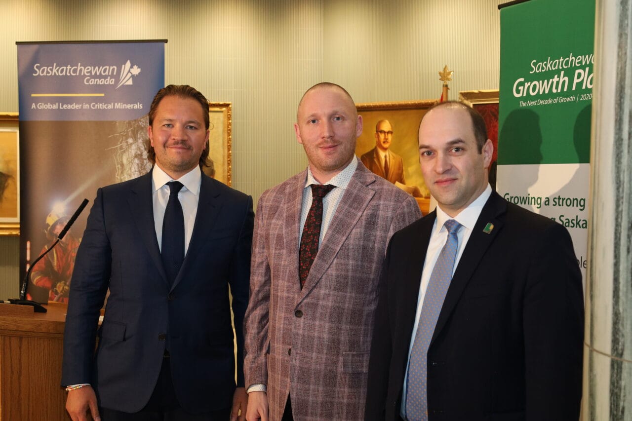 Travis McPherson (NexGen), Chris Beaudry, David Cates (Denison) stand side by side following a press conference.