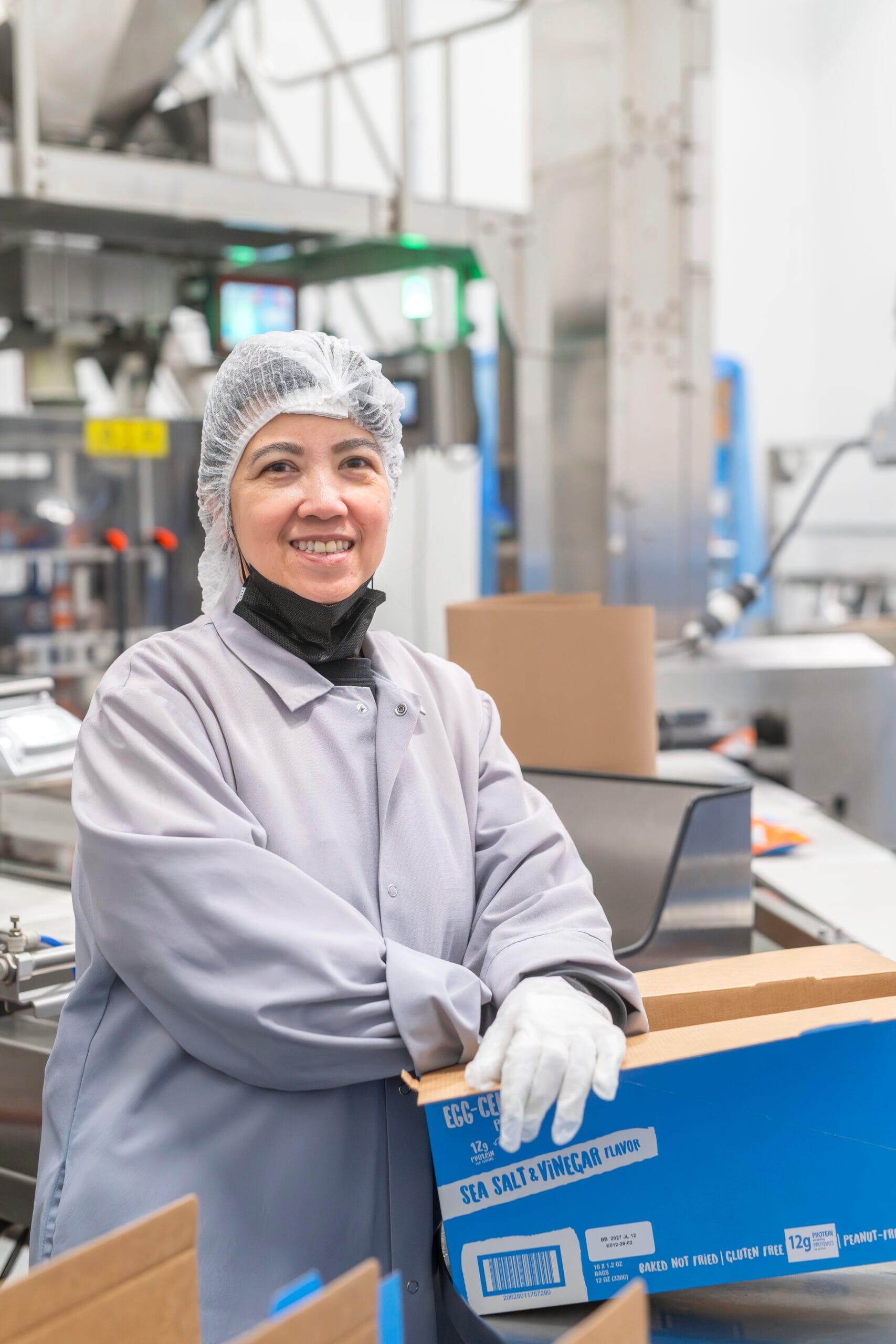 A woman packages goods for export at the Food Centre.