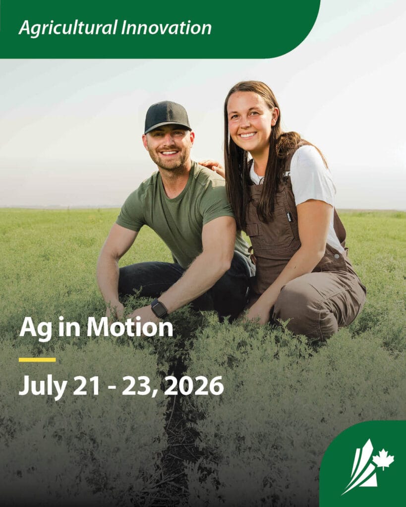 Two people sitting in a crop field. Text header reads: "Agricultural Innovation," overlay text reads: "Ag in Motion," and "July 21-23, 2026."